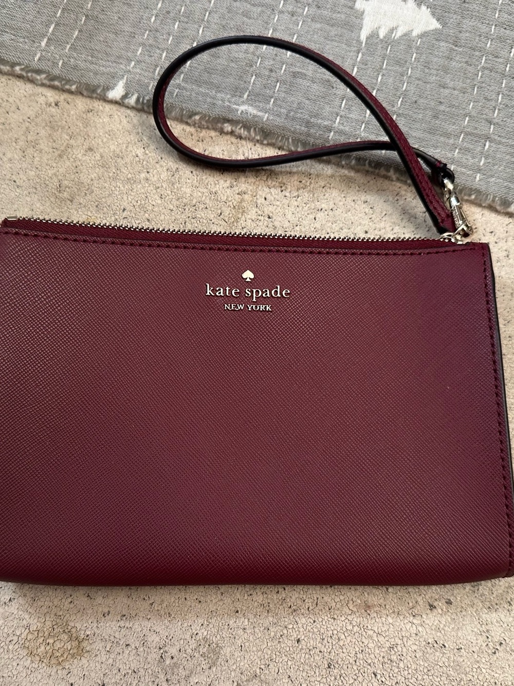Kate Spade burgundy/wine wristlet